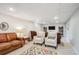 Finished basement with ample seating features a plush rug, leather sofas, and lots of space for relaxation and entertainment at 6410 Independence Way, Arvada, CO 80004