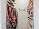 Walk-in closet with ample storage, shelves, and hooks maximizes organization and space at 6410 Independence Way, Arvada, CO 80004