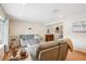 Cozy living room with hardwood floors, neutral paint, and plenty of natural light at 6410 Independence Way, Arvada, CO 80004