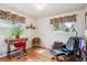 Bright office features hardwood floors, two large windows, and plenty of space for furniture at 6410 Independence Way, Arvada, CO 80004
