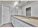 Bright bathroom featuring a double sink vanity with modern fixtures and neutral color scheme at 7277 W Adriatic Cir, Lakewood, CO 80227