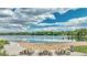 Beautiful lakeside beach area with picnic tables, ideal for relaxing and enjoying the scenery at 7277 W Adriatic Cir, Lakewood, CO 80227