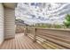 Relaxing outdoor deck with wood-like flooring, offering an ideal space for entertaining and lounging at 7277 W Adriatic Cir, Lakewood, CO 80227