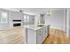 Modern kitchen featuring a white island, stainless steel appliances, and hardwood floors at 7277 W Adriatic Cir, Lakewood, CO 80227