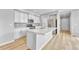 Modern kitchen featuring white cabinets, stainless steel appliances, and a kitchen island at 7277 W Adriatic Cir, Lakewood, CO 80227