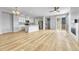 Open-concept living room featuring lots of natural light and beautiful hardwood floors at 7277 W Adriatic Cir, Lakewood, CO 80227