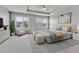 Main bedroom featuring a ceiling fan, tray ceiling, light decor, and neighborhood views from the windows at 7277 W Adriatic Cir, Lakewood, CO 80227