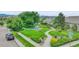 A charming neighborhood park with lush greenery, a playground, and walking paths, perfect for Gathering activities and relaxation at 7277 W Adriatic Cir, Lakewood, CO 80227