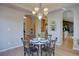 Charming dining area with modern lighting and views into the living area at 13941 E Whitaker Dr, Aurora, CO 80015