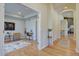 Bright hallway with hardwood floors leading to a living area, with an arched opening at 13941 E Whitaker Dr, Aurora, CO 80015