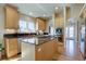 Spacious kitchen with a large island, stainless steel appliances, and hardwood floors at 13941 E Whitaker Dr, Aurora, CO 80015
