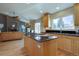 Bright kitchen with hardwood floors, stainless steel appliances, and granite countertops at 13941 E Whitaker Dr, Aurora, CO 80015