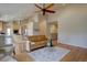 Spacious living room boasts hardwood floors, neutral walls, and seamless flow to other areas at 13941 E Whitaker Dr, Aurora, CO 80015