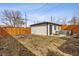 Spacious backyard features a new wooden fence and a hot tub on a concrete pad at 2111 S Franklin St, Denver, CO 80210