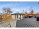 Backyard with deck includes seating, grill, and fire pit for entertaining and relaxing at 2111 S Franklin St, Denver, CO 80210