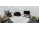 Finished basement with game table, large sectional couch, and big screen television creates a cozy recreation room at 2111 S Franklin St, Denver, CO 80210