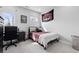 Cozy bedroom with a comfortable bed, desk area, and ample natural light, creating a perfect study space at 2111 S Franklin St, Denver, CO 80210