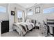 Bright bedroom with comfortable bed, neutral decor, and natural light, perfect for relaxation and rest at 2111 S Franklin St, Denver, CO 80210