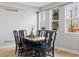 Elegant dining room with seating for six and natural light at 2111 S Franklin St, Denver, CO 80210