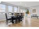 Well-lit dining room with seating for six and access to outdoor patio at 2111 S Franklin St, Denver, CO 80210