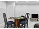 Game room featuring an octagon game table with four chairs and a large TV, designed for entertainment at 2111 S Franklin St, Denver, CO 80210
