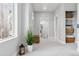 Bright hallway with recessed lights, a window, and additional storage baskets on built-in shelving at 2111 S Franklin St, Denver, CO 80210