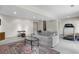 Finished basement featuring neutral carpeting, a gray sofa, and a treadmill at 7712 S Monaco E Cir, Centennial, CO 80112