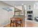 Cozy dining area with wood floors, seamlessly connecting to the living room at 7712 S Monaco E Cir, Centennial, CO 80112