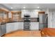 Well-equipped kitchen with stainless steel appliances, granite countertops, and ample cabinet space at 7712 S Monaco E Cir, Centennial, CO 80112