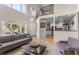 Cozy living space featuring high ceilings and views to the kitchen at 7712 S Monaco E Cir, Centennial, CO 80112
