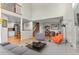 Open-concept living area with hardwood floors, a fireplace, and stylish decor at 7712 S Monaco E Cir, Centennial, CO 80112