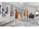 Spacious bedroom with built-in bookshelves and access to an ensuite bathroom at 7712 S Monaco E Cir, Centennial, CO 80112