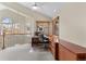 Bright lofted office with a ceiling fan, natural light, and wood trim windows at 7712 S Monaco E Cir, Centennial, CO 80112