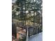 Picturesque backyard featuring mature trees and a wooden fence, offering privacy and natural beauty at 160 Bristlecone Way, Boulder, CO 80304