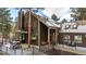 Charming home featuring a multi-tiered deck, mature trees, and mountain views at 160 Bristlecone Way, Boulder, CO 80304