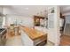 Modern kitchen with butcher block island, stainless steel appliances, and white cabinets at 160 Bristlecone Way, Boulder, CO 80304