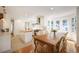 Spacious eat-in kitchen features stainless appliances, kitchen island and tree-lined backyard views at 160 Bristlecone Way, Boulder, CO 80304