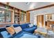 Cozy living room features a comfortable blue sofa, natural light, and elegant wood accents at 160 Bristlecone Way, Boulder, CO 80304