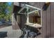 Outdoor bar with open window to the kitchen, offering seamless indoor-outdoor dining and entertainment at 160 Bristlecone Way, Boulder, CO 80304