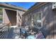 Relaxing outdoor seating area on a wooden deck, surrounded by lush greenery and serene views at 160 Bristlecone Way, Boulder, CO 80304