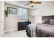 Comfortable bedroom with soft carpet, bright natural light, and traditional dark furniture at 2345 N Clay St # 6, Denver, CO 80211