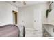 Neutral bedroom featuring soft carpet, ceiling fan, and white doors at 2345 N Clay St # 6, Denver, CO 80211