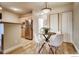 Dining area with hardwood floors, modern lighting, and stainless steel appliances at 2345 N Clay St # 6, Denver, CO 80211