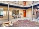 Exterior condo courtyard view with seating area and orange entry doors at 2345 N Clay St # 6, Denver, CO 80211