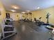 Bright home gym featuring free weights, stationary bike and other exercise equipment at 2345 N Clay St # 6, Denver, CO 80211