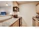 Efficient kitchen space with wooden cabinets, granite countertops, and stainless steel appliances at 2345 N Clay St # 6, Denver, CO 80211