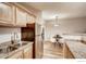 Kitchen features stainless steel appliances, granite counters, and wood cabinets at 2345 N Clay St # 6, Denver, CO 80211