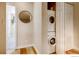 Laundry closet with stacked washer and dryer unit at 2345 N Clay St # 6, Denver, CO 80211