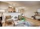 Comfortable living room with hardwood floors, open layout, and dining area at 2345 N Clay St # 6, Denver, CO 80211