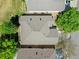 An aerial view showing the roof and the surrounding trees and lawn at 946 Champion Cir, Longmont, CO 80503